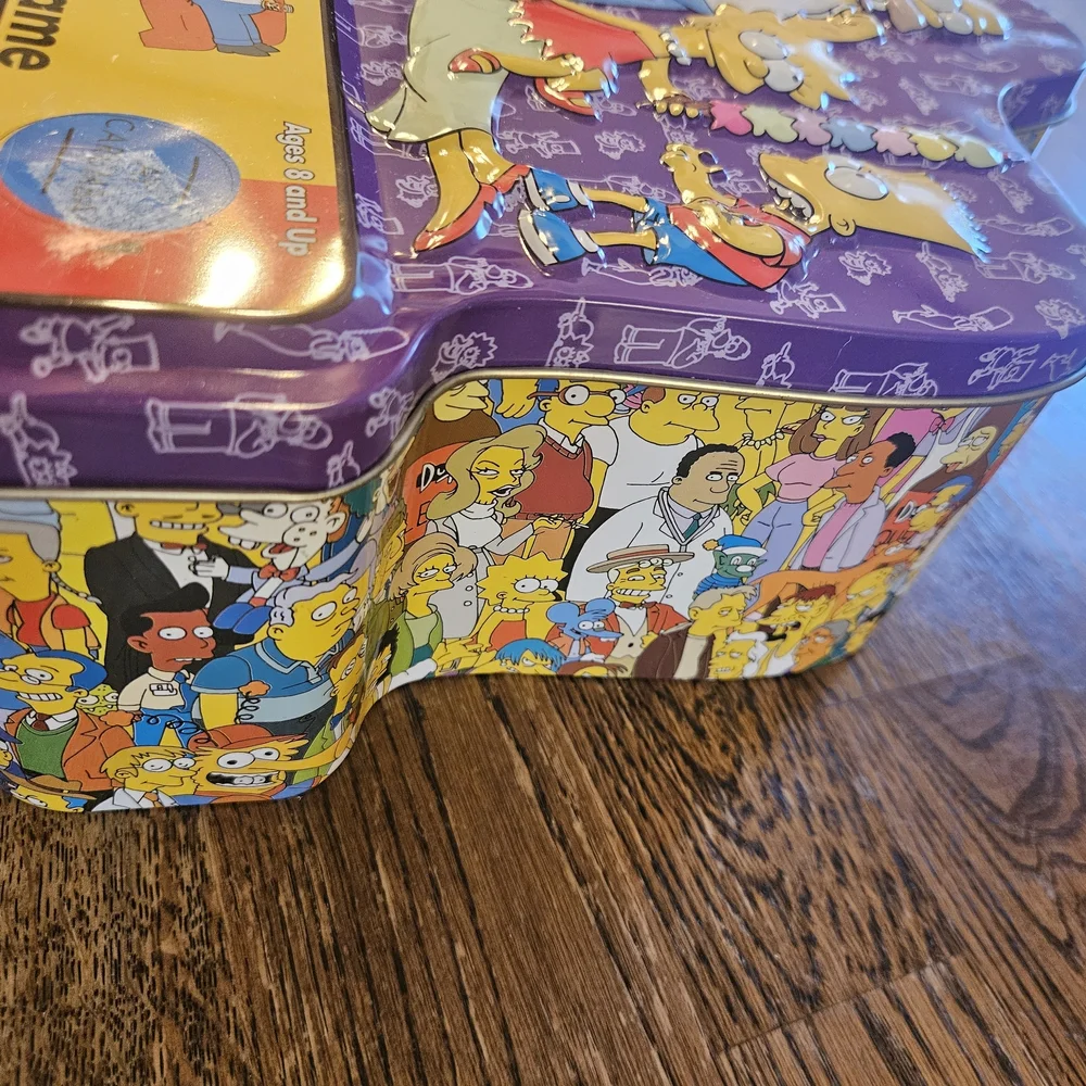 The Simpsons Trivia Game 2000 Board Game in Collectors Tin with Cast Poster